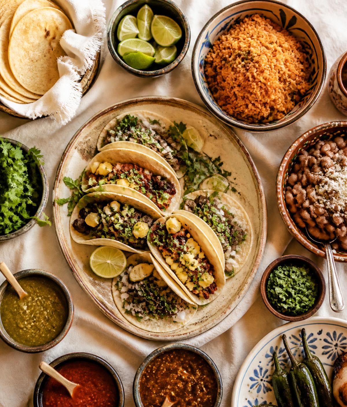 Overhead spread of Mexican tacos, salsas, rice and beans served at Asuncion in Billings